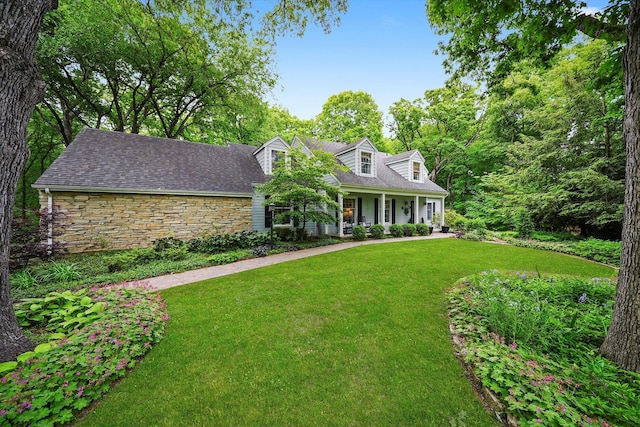 4N307 Knoll Creek Dr, Saint Charles, IL 60175 - cape cod house featuring a front lawn, covered porch, and stone siding