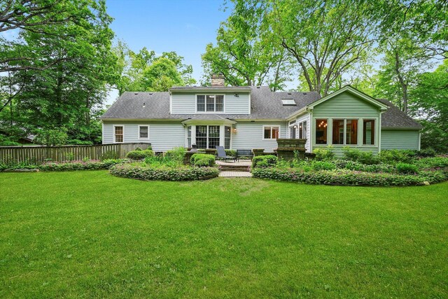 4N307 Knoll Creek Dr, Saint Charles, IL 60175 - rear view of property featuring a chimney, a yard, roof with shingles, and a patio area