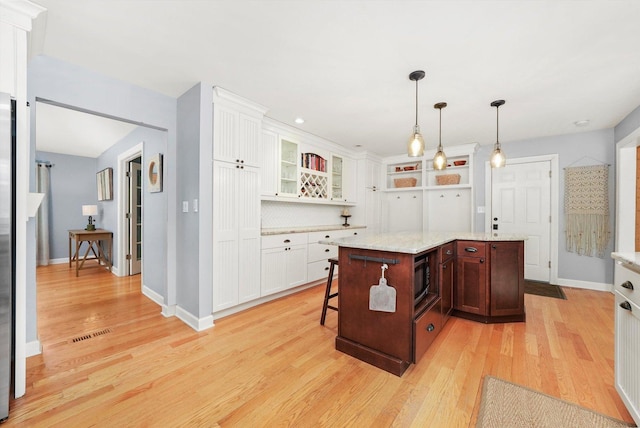 4N307 Knoll Creek Dr, Saint Charles, IL 60175 - kitchen featuring light wood-type flooring, white cabinets, and baseboards