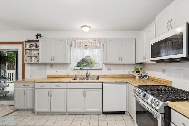 125 W Sprucewood Ln, Round Lake Beach, IL 60073 - kitchen with white appliances, butcher block countertops, and tasteful backsplash