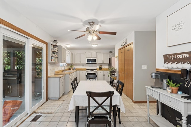 125 W Sprucewood Ln, Round Lake Beach, IL 60073 - dining area featuring ceiling fan and light tile patterned flooring