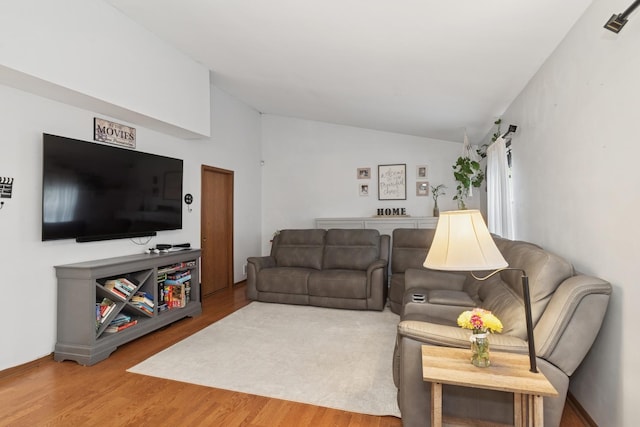 125 W Sprucewood Ln, Round Lake Beach, IL 60073 - living room with vaulted ceiling and wood finished floors