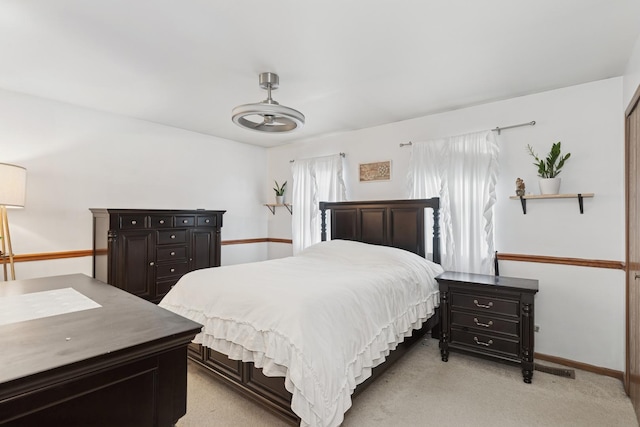 125 W Sprucewood Ln, Round Lake Beach, IL 60073 - bedroom with light colored carpet and baseboards