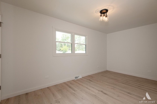 9058 Caddy Ct, Orland Park, IL 60462 - empty room featuring light wood-style floors and baseboards