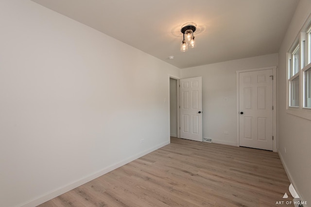 9058 Caddy Ct, Orland Park, IL 60462 - unfurnished bedroom with light wood finished floors