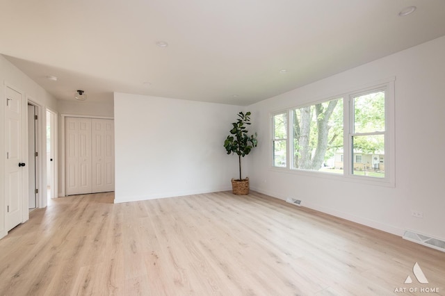 9058 Caddy Ct, Orland Park, IL 60462 - empty room with light wood-style floors and baseboards
