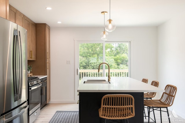 9058 Caddy Ct, Orland Park, IL 60462 - kitchen with stainless steel appliances, a breakfast bar, light wood-style flooring, recessed lighting, and brown cabinetry