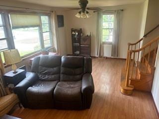785 Alice St, Chicago Heights, IL 60411 - living room with wood finished floors, stairway, and a ceiling fan