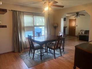 785 Alice St, Chicago Heights, IL 60411 - dining space with a ceiling fan, wood finished floors, and arched walkways