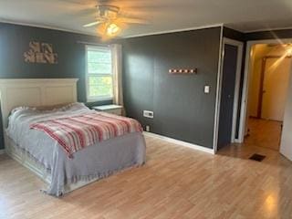 785 Alice St, Chicago Heights, IL 60411 - bedroom featuring wood finished floors and a ceiling fan