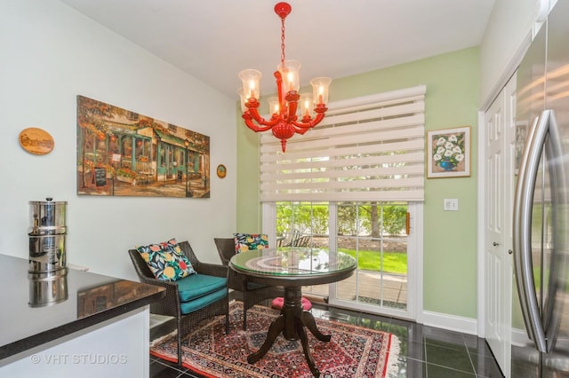 7410 Lincoln Ave Unit A, Skokie, IL 60076 - dining area featuring a chandelier, dark tile patterned floors, and baseboards