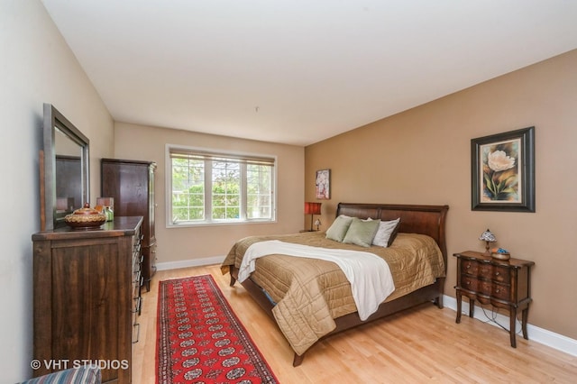 7410 Lincoln Ave Unit A, Skokie, IL 60076 - bedroom featuring baseboards and light wood-style floors