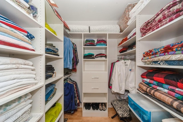 7410 Lincoln Ave Unit A, Skokie, IL 60076 - walk in closet with wood finished floors