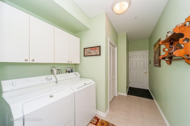 7410 Lincoln Ave Unit A, Skokie, IL 60076 - laundry area with cabinet space, washer and dryer, light tile patterned floors, and baseboards