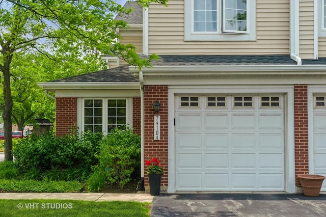 7410 Lincoln Ave Unit A, Skokie, IL 60076 - garage featuring asphalt driveway
