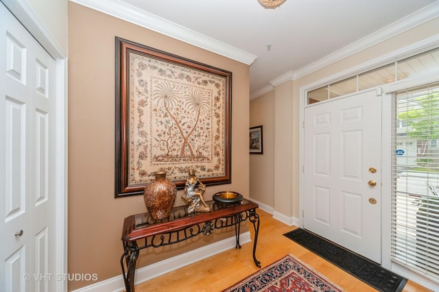 7410 Lincoln Ave Unit A, Skokie, IL 60076 - foyer entrance featuring light wood-type flooring, ornamental molding, and baseboards