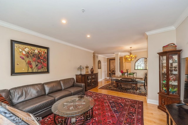 7410 Lincoln Ave Unit A, Skokie, IL 60076 - living room with a chandelier, light wood-style floors, ornamental molding, recessed lighting, and arched walkways