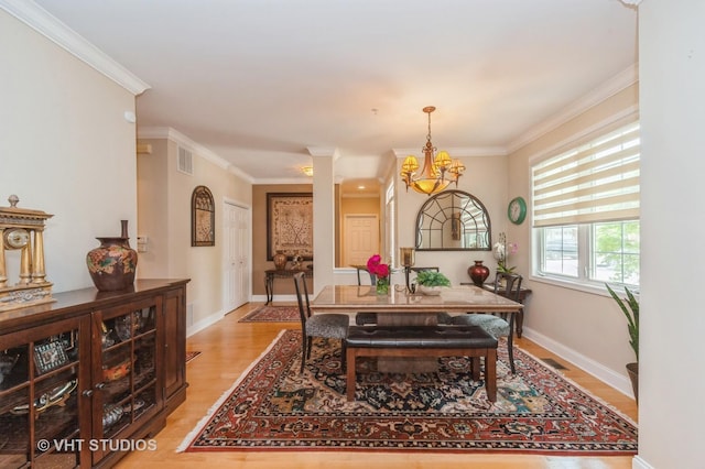 7410 Lincoln Ave Unit A, Skokie, IL 60076 - dining space with a chandelier, crown molding, light wood-type flooring, and baseboards
