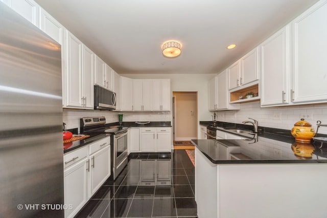 7410 Lincoln Ave Unit A, Skokie, IL 60076 - kitchen with appliances with stainless steel finishes, dark countertops, white cabinetry, and recessed lighting