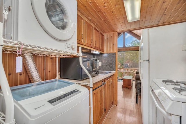 1 Dinosaur Rd, Wilmington, IL 60481 - laundry room with stacked washer and clothes dryer, wood ceiling, and light wood-type flooring