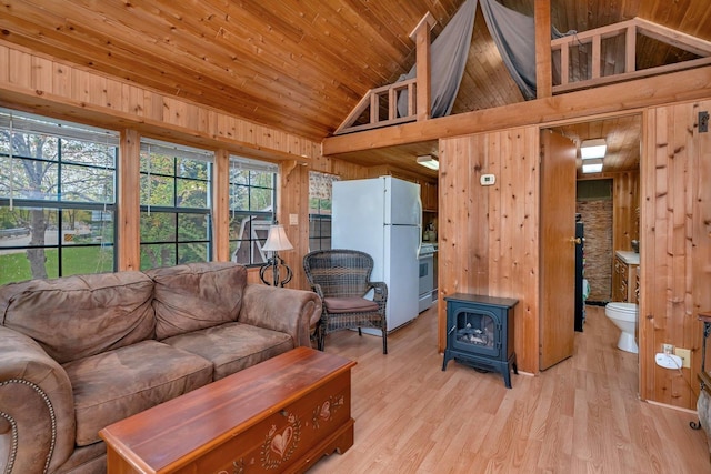 1 Dinosaur Rd, Wilmington, IL 60481 - living area with wooden walls, a wood stove, light wood-type flooring, wood ceiling, and high vaulted ceiling