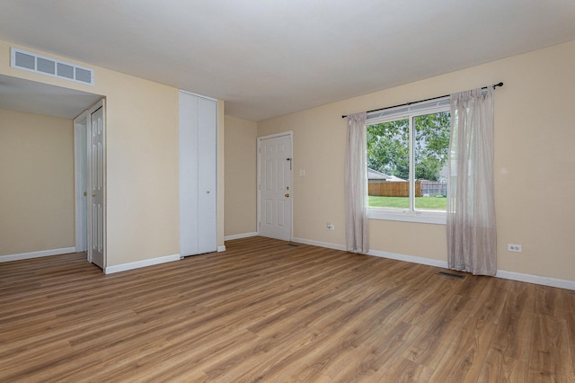 931 Mosby Ct, Joliet, IL 60431 - unfurnished room with light wood-style floors and baseboards