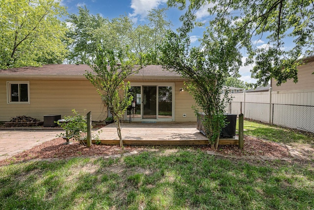 931 Mosby Ct, Joliet, IL 60431 - back of property with a wooden deck and central AC unit