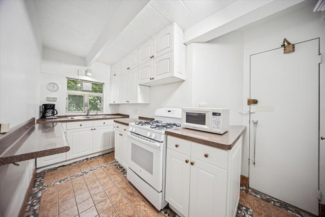 1866 Sherman Ave Unit 3Ne, Evanston, IL 60201 - kitchen with white appliances, beamed ceiling, white cabinetry, and dark countertops