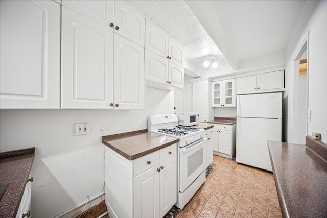 1866 Sherman Ave Unit 3Ne, Evanston, IL 60201 - kitchen with white appliances, dark countertops, and white cabinets