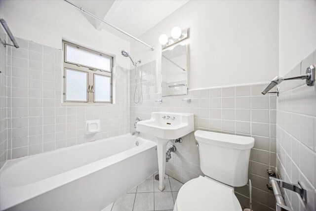 1866 Sherman Ave Unit 3Ne, Evanston, IL 60201 - bathroom featuring  shower combination, tile walls, and tile patterned flooring
