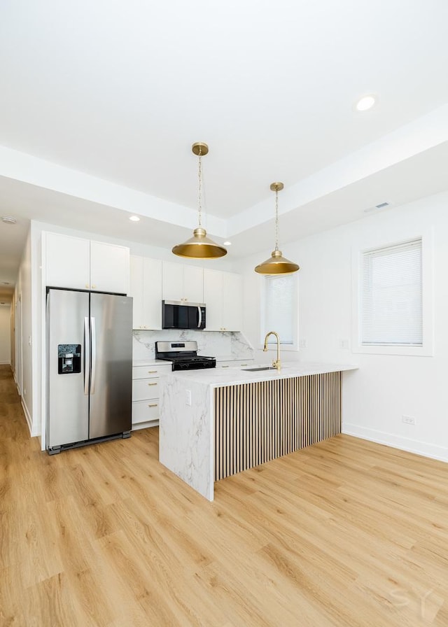 6048 S Eberhart Ave, Chicago, IL 60637 - kitchen with appliances with stainless steel finishes, a sink, light wood-type flooring, white cabinets, and recessed lighting
