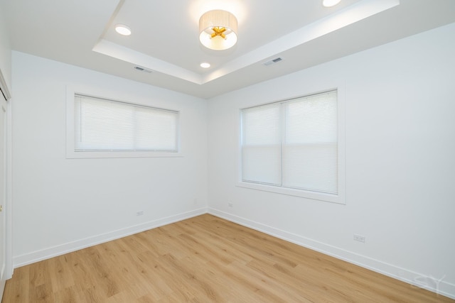 6048 S Eberhart Ave, Chicago, IL 60637 - unfurnished room featuring a raised ceiling, light wood finished floors, baseboards, and recessed lighting