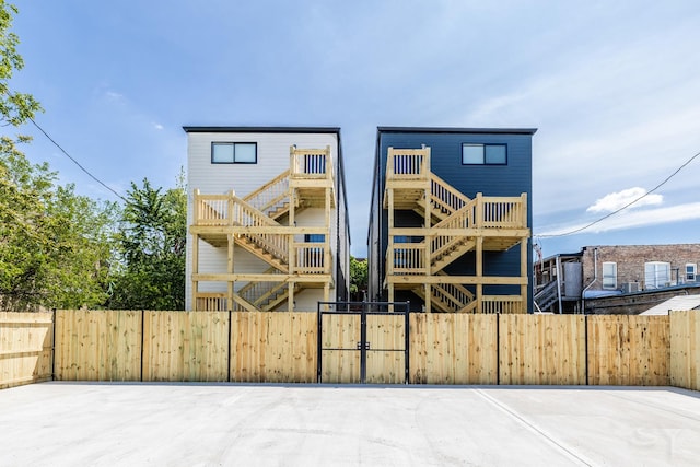 6048 S Eberhart Ave, Chicago, IL 60637 - view of front facade with stairs and a gate
