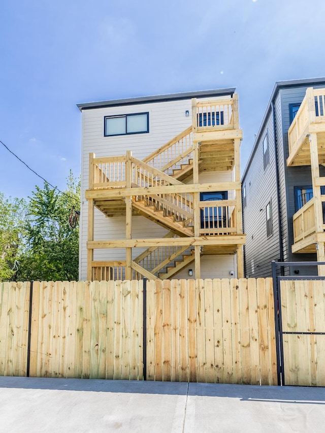 6048 S Eberhart Ave, Chicago, IL 60637 - view of front of home with stairway and a deck