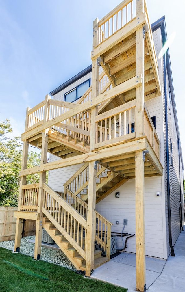 6048 S Eberhart Ave, Chicago, IL 60637 - view of side of home featuring stairway and a deck