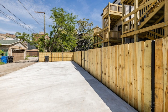 6048 S Eberhart Ave, Chicago, IL 60637 - view of patio / terrace with a garage and driveway