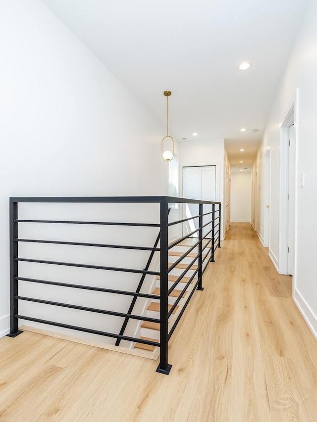 6048 S Eberhart Ave, Chicago, IL 60637 - hall with light wood finished floors, recessed lighting, an upstairs landing, and baseboards