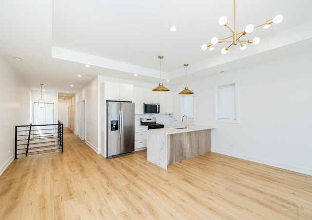 6048 S Eberhart Ave, Chicago, IL 60637 - kitchen featuring appliances with stainless steel finishes, a raised ceiling, recessed lighting, a peninsula, and white cabinetry