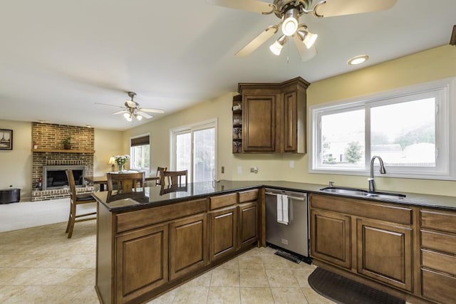 1161 Sumner Cir, Gurnee, IL 60031 - kitchen featuring a ceiling fan, dishwasher, a sink, a peninsula, and a brick fireplace