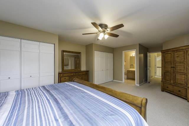 1161 Sumner Cir, Gurnee, IL 60031 - bedroom with two closets, baseboards, light colored carpet, ceiling fan, and ensuite bath