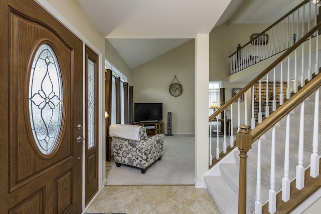 1161 Sumner Cir, Gurnee, IL 60031 - foyer featuring light colored carpet, light tile patterned floors, stairs, lofted ceiling, and baseboards