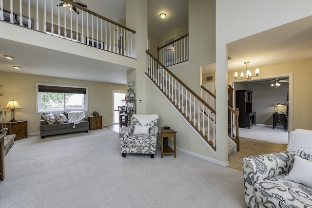 1161 Sumner Cir, Gurnee, IL 60031 - living area featuring carpet floors, ceiling fan, stairway, a chandelier, and baseboards