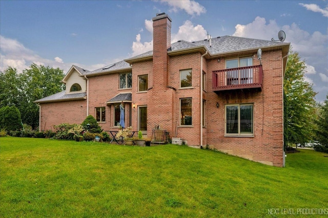 13851 S Janas Pkwy, Homer Glen, IL 60491 - back of house with a balcony, brick siding, a chimney, and a yard