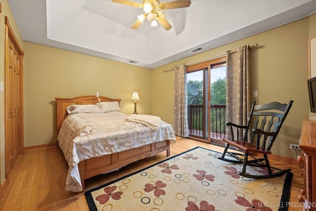 13851 S Janas Pkwy, Homer Glen, IL 60491 - bedroom with wood finished floors, access to exterior, a raised ceiling, and baseboards