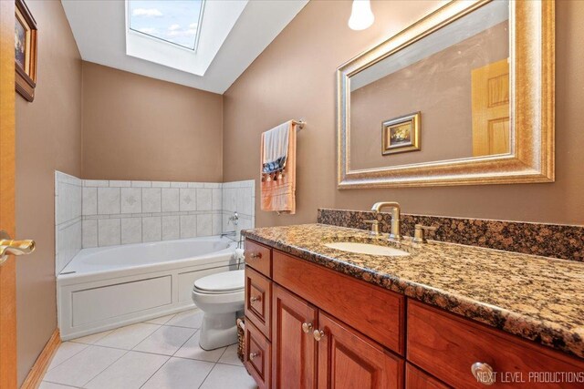 13851 S Janas Pkwy, Homer Glen, IL 60491 - full bath featuring a skylight, toilet, vanity, tile patterned flooring, and a garden tub