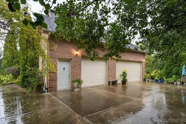 13851 S Janas Pkwy, Homer Glen, IL 60491 - garage featuring concrete driveway