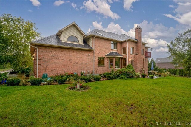 13851 S Janas Pkwy, Homer Glen, IL 60491 - rear view of property with brick siding, a yard, and a chimney