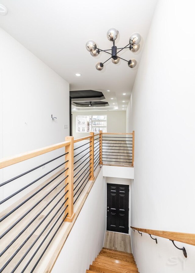 5530 S Michigan Ave, Chicago, IL 60637 - stairs featuring a chandelier, wood finished floors, and recessed lighting