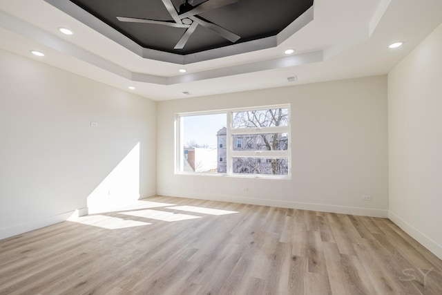 5530 S Michigan Ave, Chicago, IL 60637 - empty room with a raised ceiling, ceiling fan, light wood-type flooring, recessed lighting, and baseboards