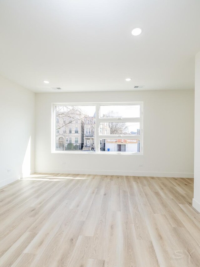 5534 S Michigan Ave, Chicago, IL 60637 - spare room featuring light wood-type flooring, healthy amount of natural light, baseboards, and recessed lighting